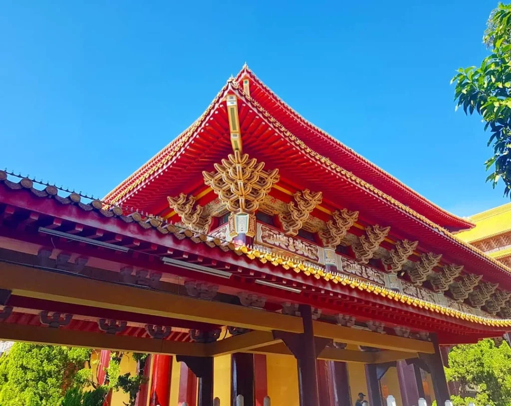 Cruising with Danny and Peter, Holland America Line, Westerdam, Kaohsiung, Taiwan | A serene Buddhist temple in Kaohsiung, showcasing intricate artwork and vibrant colors, representing the city's cultural heritage; beautiful views of Lotus Lake with picturesque pagodas and blooming lotus flowers, capturing the stunning natural landscapes; a bustling street food market with vendors offering local delicacies, highlighting Kaohsiung's vibrant local cuisine and inviting visitors to join a memorable street food tour.