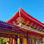 Cruising with Danny and Peter, Holland America Line, Westerdam, Kaohsiung, Taiwan | A serene Buddhist temple in Kaohsiung, showcasing intricate artwork and vibrant colors, representing the city's cultural heritage; beautiful views of Lotus Lake with picturesque pagodas and blooming lotus flowers, capturing the stunning natural landscapes; a bustling street food market with vendors offering local delicacies, highlighting Kaohsiung's vibrant local cuisine and inviting visitors to join a memorable street food tour.