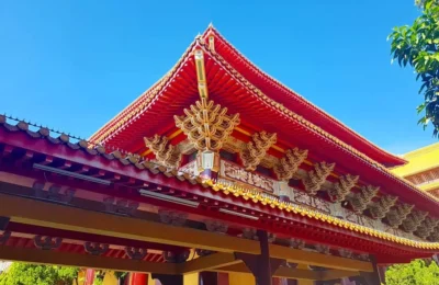 Cruising with Danny and Peter, Holland America Line, Westerdam, Kaohsiung, Taiwan | A serene Buddhist temple in Kaohsiung, showcasing intricate artwork and vibrant colors, representing the city's cultural heritage; beautiful views of Lotus Lake with picturesque pagodas and blooming lotus flowers, capturing the stunning natural landscapes; a bustling street food market with vendors offering local delicacies, highlighting Kaohsiung's vibrant local cuisine and inviting visitors to join a memorable street food tour.