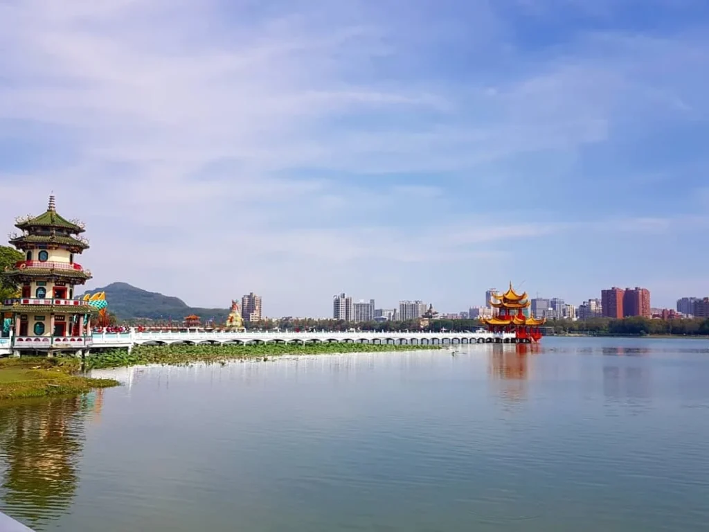 Cruising with Danny and Peter, Holland America Line, Westerdam, Kaohsiung, Taiwan | A serene Buddhist temple in Kaohsiung, showcasing intricate artwork and vibrant colors, representing the city's cultural heritage; beautiful views of Lotus Lake with picturesque pagodas and blooming lotus flowers, capturing the stunning natural landscapes; a bustling street food market with vendors offering local delicacies, highlighting Kaohsiung's vibrant local cuisine and inviting visitors to join a memorable street food tour.