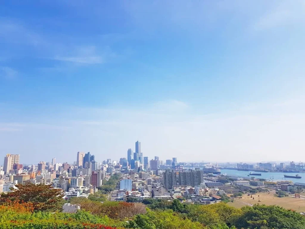 Cruising with Danny and Peter, Holland America Line, Westerdam, Kaohsiung, Taiwan | A serene Buddhist temple in Kaohsiung, showcasing intricate artwork and vibrant colors, representing the city's cultural heritage; beautiful views of Lotus Lake with picturesque pagodas and blooming lotus flowers, capturing the stunning natural landscapes; a bustling street food market with vendors offering local delicacies, highlighting Kaohsiung's vibrant local cuisine and inviting visitors to join a memorable street food tour.