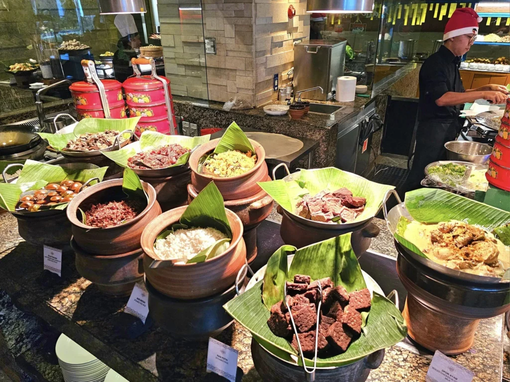 Cruising with Danny and Peter, Holland America Line, Westerdam, Tanjung Priok, Jakarta, Java, Indonesia | Experience Jakarta's rich heritage and culinary delights: Tanjung Priok Port highlights its bustling maritime history, while historic Phinisi schooners at Sunda Kelapa and Dutch colonial architecture in Batavia Stad reflect Jakarta’s past. Enjoy panoramic views from Monas National Monument and savor a delicious Indonesian buffet lunch showcasing traditional dishes. Explore Taman Mini Indonesia Indah to see diverse cultural pavilions representing Indonesia's rich heritage.