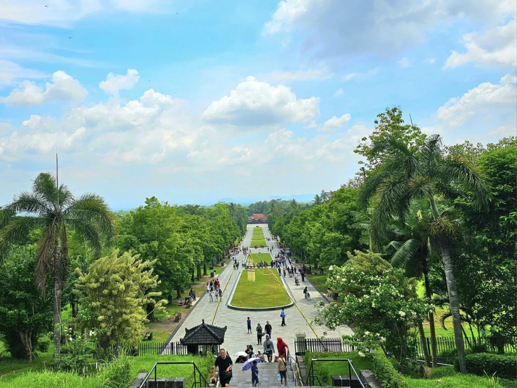 Cruising with Danny and Peter, Holland America Line, Westerdam, Semarang, Java, Indonesia, Borobudur Temple Cruise, Java Adventure | Panoramic view of Borobudur during a Borobudur Temple Cruise, showcasing the UNESCO Buddhist Temple amidst Central Java’s lush hills, with the Westerdam ship docked for the Holland America Westerdam Borobudur Tour, a Luxury Cruise Java adventure in Holland America Far East. Close-up of stupas and Buddha statues at Borobudur, reflecting Mahayana Buddhist Heritage, alongside a vibrant market scene from a Semarang Java Tour, part of an Indonesian Cultural Journey. Travelers explore this Borobudur Pilgrimage Site on a Central Java Travel excursion, enjoying a stunning sunset over the 9th-Century Temple Exploration, with detailed stone reliefs of the UNESCO Buddhist Temple and relaxation on the Westerdam deck during a Westerdam Cruise Indonesia.