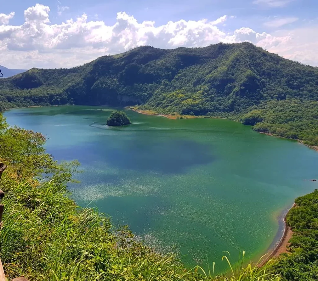 Cruising with Danny and Peter, Holland America Line, Westerdam, Manila, Philippines | Scenic boat ride across the lake to Taal Volcano, part of a thrilling Manila Volcano Adventure. Horseback riding through the lush countryside, leading to a volcanic crater trek and the breathtaking views from Taal's summit. A memorable countryside escape from Manila to the volcano, showcasing the natural beauty of the Philippines, with stunning landscapes, panoramic vistas, and outdoor adventure near Manila. The volcano summit experience highlights lakeside volcanic exploration and a unique Manila day trip to Taal Volcano.
