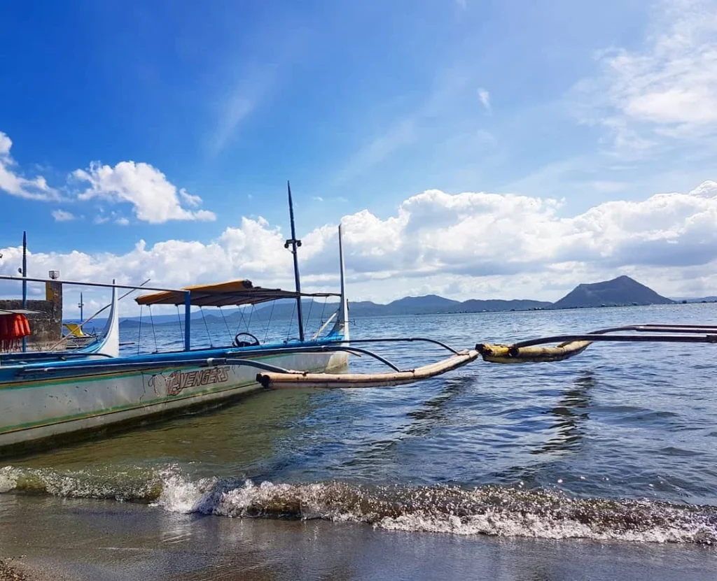 Cruising with Danny and Peter, Holland America Line, Westerdam, Manila, Philippines | Scenic boat ride across the lake to Taal Volcano, part of a thrilling Manila Volcano Adventure. Horseback riding through the lush countryside, leading to a volcanic crater trek and the breathtaking views from Taal's summit. A memorable countryside escape from Manila to the volcano, showcasing the natural beauty of the Philippines, with stunning landscapes, panoramic vistas, and outdoor adventure near Manila. The volcano summit experience highlights lakeside volcanic exploration and a unique Manila day trip to Taal Volcano.