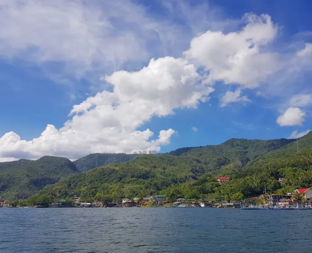 Cruising with Danny and Peter, Holland America Line, Westerdam, Manila, Philippines | Scenic boat ride across the lake to Taal Volcano, part of a thrilling Manila Volcano Adventure. Horseback riding through the lush countryside, leading to a volcanic crater trek and the breathtaking views from Taal's summit. A memorable countryside escape from Manila to the volcano, showcasing the natural beauty of the Philippines, with stunning landscapes, panoramic vistas, and outdoor adventure near Manila. The volcano summit experience highlights lakeside volcanic exploration and a unique Manila day trip to Taal Volcano.