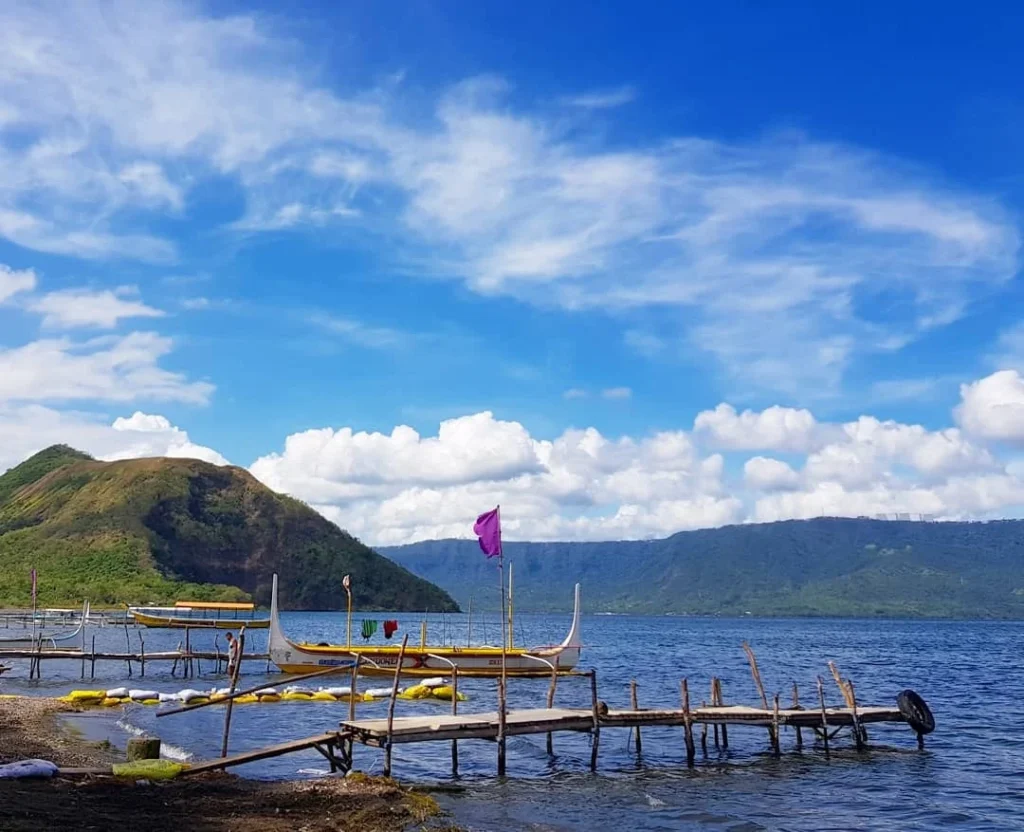 Cruising with Danny and Peter, Holland America Line, Westerdam, Manila, Philippines | Scenic boat ride across the lake to Taal Volcano, part of a thrilling Manila Volcano Adventure. Horseback riding through the lush countryside, leading to a volcanic crater trek and the breathtaking views from Taal's summit. A memorable countryside escape from Manila to the volcano, showcasing the natural beauty of the Philippines, with stunning landscapes, panoramic vistas, and outdoor adventure near Manila. The volcano summit experience highlights lakeside volcanic exploration and a unique Manila day trip to Taal Volcano.