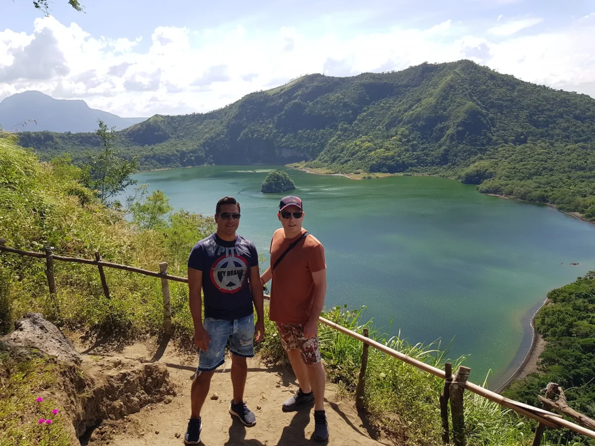 Cruising with Danny and Peter, Holland America Line, Westerdam, Manila, Philippines | Scenic boat ride across the lake to Taal Volcano, part of a thrilling Manila Volcano Adventure. Horseback riding through the lush countryside, leading to a volcanic crater trek and the breathtaking views from Taal's summit. A memorable countryside escape from Manila to the volcano, showcasing the natural beauty of the Philippines, with stunning landscapes, panoramic vistas, and outdoor adventure near Manila. The volcano summit experience highlights lakeside volcanic exploration and a unique Manila day trip to Taal Volcano.