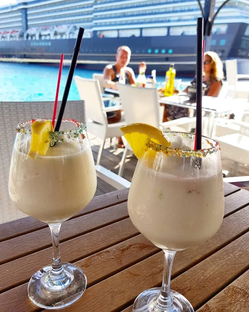 Cruising with Danny and Peter, Holland America Line, Zuiderdam, Kralendijk, Bonaire | A vibrant underwater scene showcasing colorful coral reefs and diverse marine life during a snorkeling adventure in Kralendijk, Bonaire, with tropical waters inviting exploration.