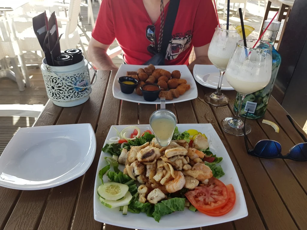 Cruising with Danny and Peter, Holland America Line, Zuiderdam, Kralendijk, Bonaire | A vibrant underwater scene showcasing colorful coral reefs and diverse marine life during a snorkeling adventure in Kralendijk, Bonaire, with tropical waters inviting exploration.
