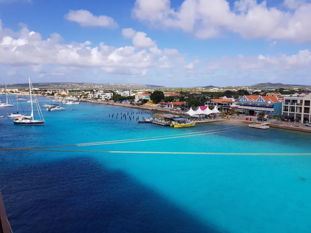 Cruising with Danny and Peter, Holland America Line, Zuiderdam, Kralendijk, Bonaire | A vibrant underwater scene showcasing colorful coral reefs and diverse marine life during a snorkeling adventure in Kralendijk, Bonaire, with tropical waters inviting exploration.