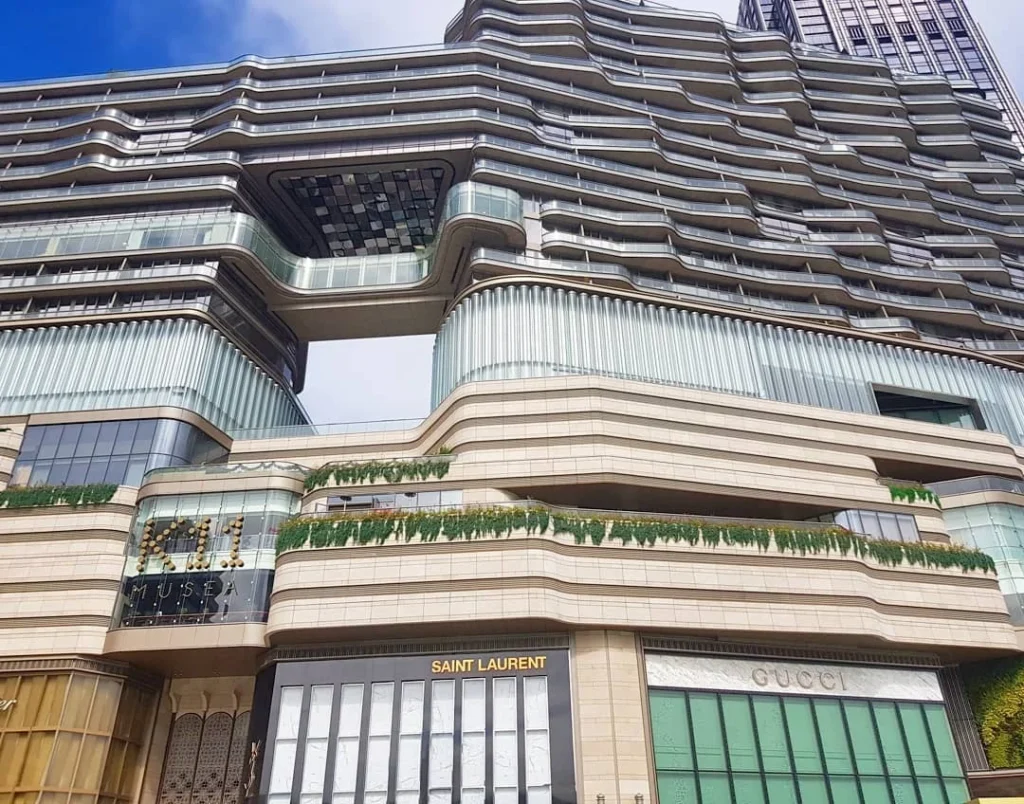 Cruising with Danny and Peter, Holland America Line, Westerdam, Hong Kong, China | A vibrant street in Kun Tong District, Hong Kong, showcasing colorful street art and local markets filled with fresh produce, reflecting the unique blend of traditional and modern Hong Kong culture, highlighting the culinary delights and bustling atmosphere of this captivating neighborhood.