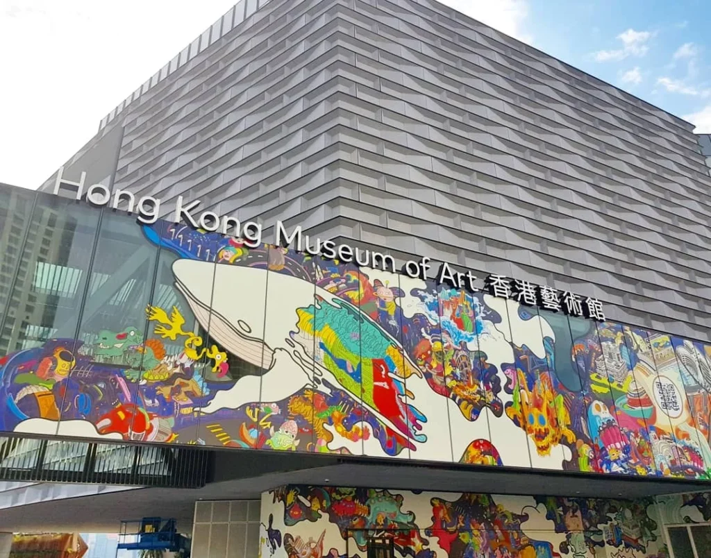 Cruising with Danny and Peter, Holland America Line, Westerdam, Hong Kong, China | A vibrant street in Kun Tong District, Hong Kong, showcasing colorful street art and local markets filled with fresh produce, reflecting the unique blend of traditional and modern Hong Kong culture, highlighting the culinary delights and bustling atmosphere of this captivating neighborhood.