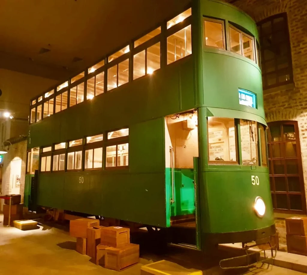 Cruising with Danny and Peter, Holland America Line, Westerdam, Hong Kong, China | A vibrant street in Kun Tong District, Hong Kong, showcasing colorful street art and local markets filled with fresh produce, reflecting the unique blend of traditional and modern Hong Kong culture, highlighting the culinary delights and bustling atmosphere of this captivating neighborhood.