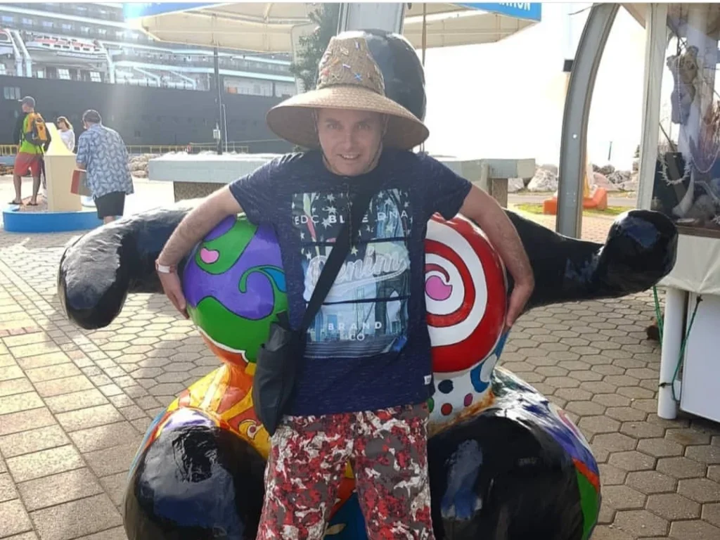 Cruising with Danny and Peter, Holland America Line, Zuiderdam, Willemstad, Curacao | Pristine sandy beach and turquoise waters at Wet & Wild Beach Club in Willemstad, Curaçao, featuring snorkeling enthusiasts exploring vibrant coral reefs, thrilling water sports like jet skiing and parasailing, and a spectacular sunset view from the beachfront bar, showcasing the ultimate Caribbean beach resort experience.