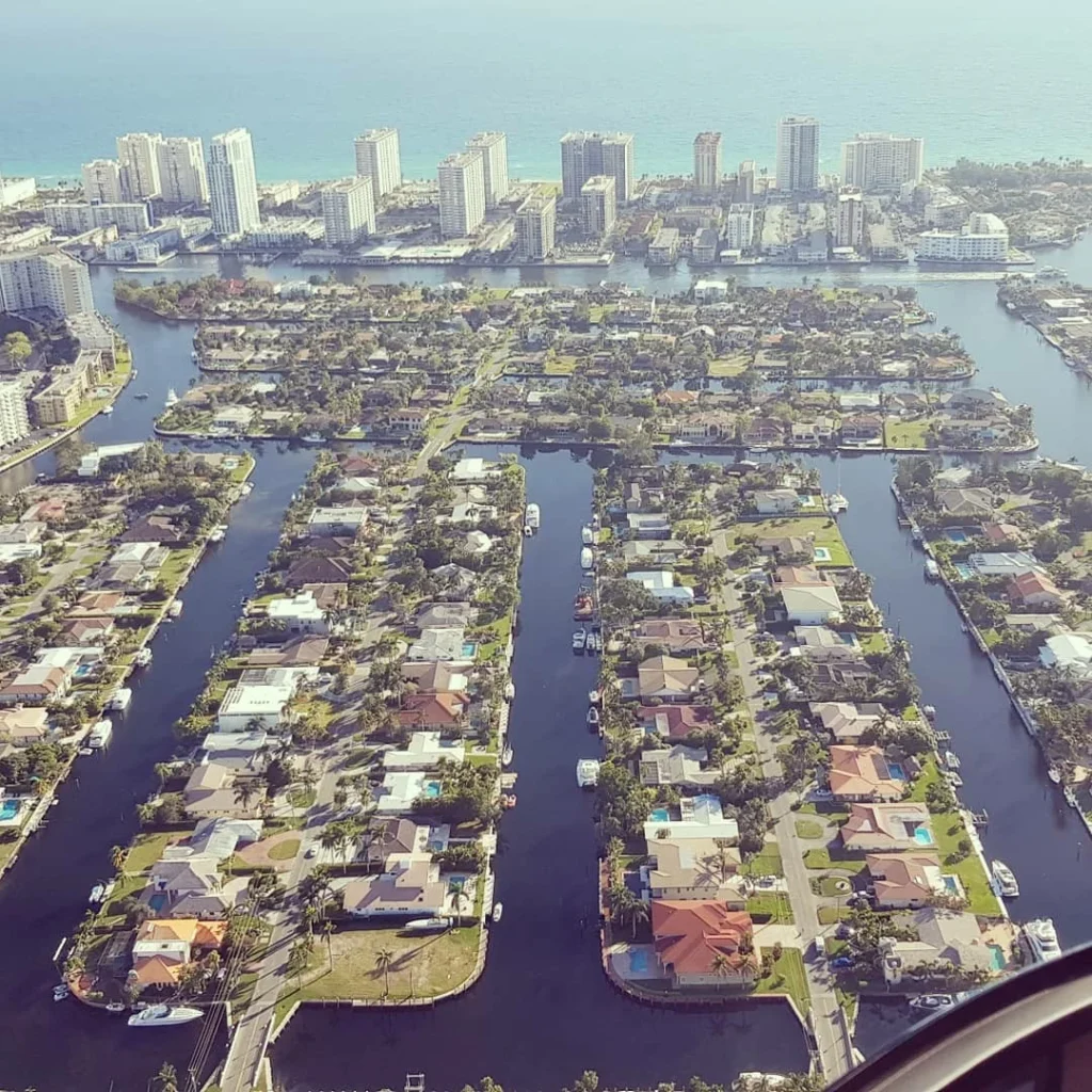 Cruising with Danny and Peter, Holland America Line, Nieuw Amsterdam, Miami, Florida, United States | Stunning aerial view of Miami’s skyline from a private helicopter tour, showcasing iconic landmarks, pristine beaches, and vibrant neighborhoods during a scenic helicopter flight.