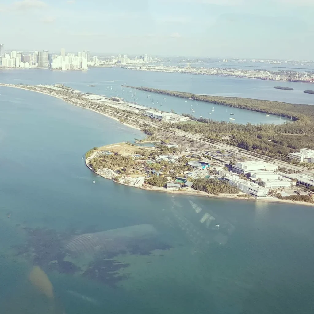 Cruising with Danny and Peter, Holland America Line, Nieuw Amsterdam, Miami, Florida, United States | Stunning aerial view of Miami’s skyline from a private helicopter tour, showcasing iconic landmarks, pristine beaches, and vibrant neighborhoods during a scenic helicopter flight.