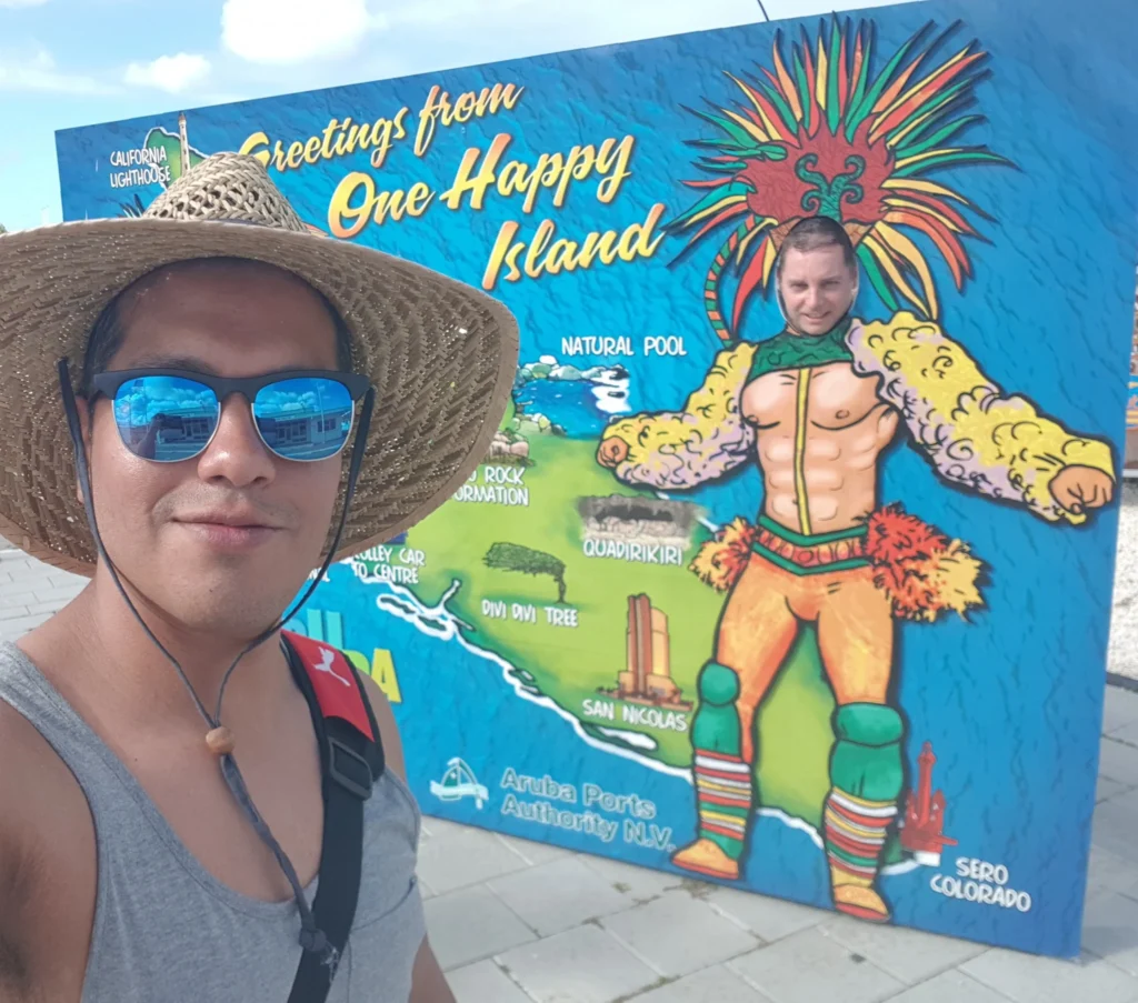 Cruising with Danny and Peter, Holland America Line, Zuiderdam, Oranjestad, Aruba | Vibrant view of Oranjestad Beach with powdery sands and turquoise waters during a relaxing beach day in Aruba, showcasing local beachfront dining and coastal activities.