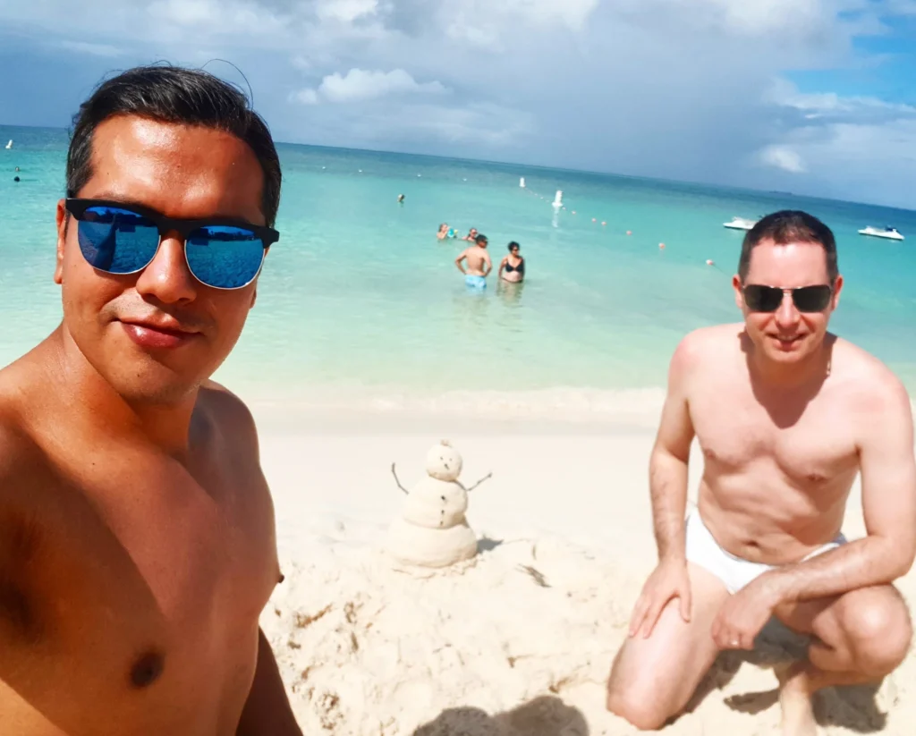 Cruising with Danny and Peter, Holland America Line, Zuiderdam, Oranjestad, Aruba | Vibrant view of Oranjestad Beach with powdery sands and turquoise waters during a relaxing beach day in Aruba, showcasing local beachfront dining and coastal activities.