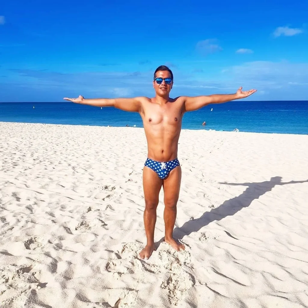 Cruising with Danny and Peter, Holland America Line, Zuiderdam, Oranjestad, Aruba | Vibrant view of Oranjestad Beach with powdery sands and turquoise waters during a relaxing beach day in Aruba, showcasing local beachfront dining and coastal activities.