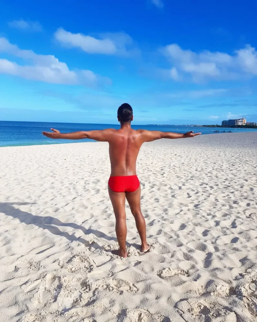 Cruising with Danny and Peter, Holland America Line, Zuiderdam, Oranjestad, Aruba | Vibrant view of Oranjestad Beach with powdery sands and turquoise waters during a relaxing beach day in Aruba, showcasing local beachfront dining and coastal activities.