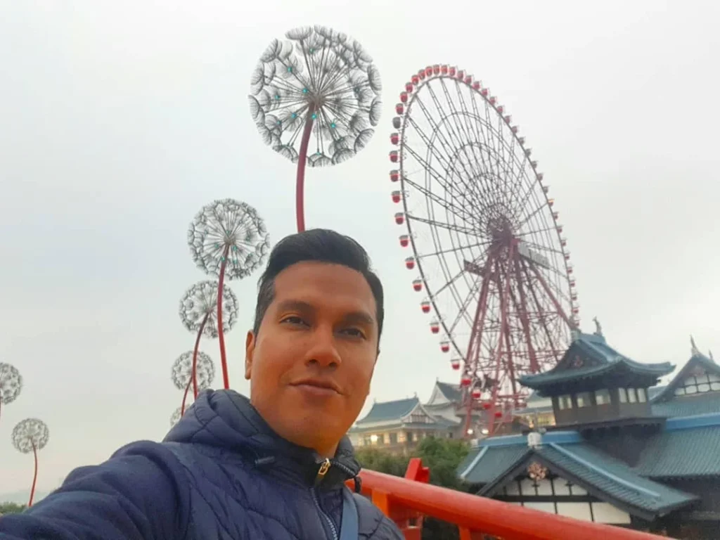 Cruising with Danny and Peter, Holland America Line, Westerdam, Halong Bay, Vietnam | A stunning view of the Hạ Long Bay Yacht cruising through emerald waters, surrounded by majestic limestone karsts. Guests enjoy Vietnamese seafood dining on the deck while kayaking in Hạ Long Bay. The private yacht tour showcases the beauty of this UNESCO World Heritage site.