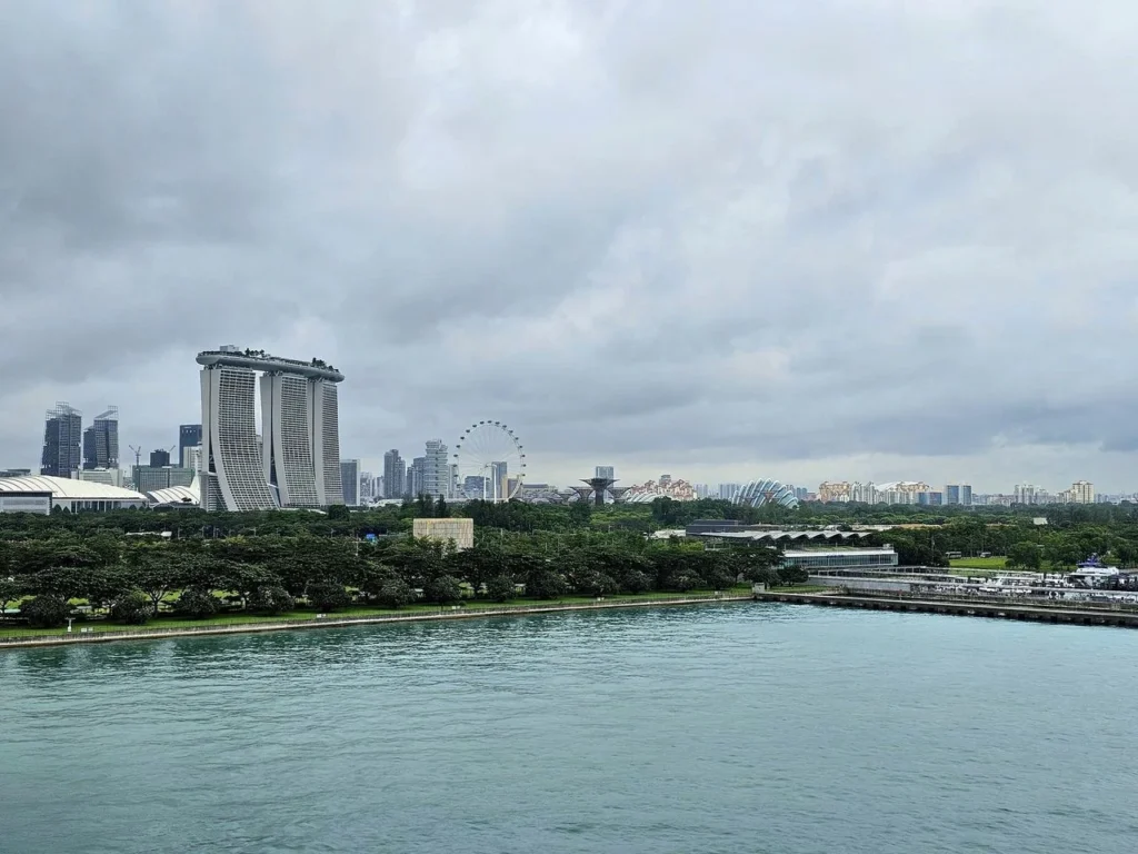 Cruising with Danny and Peter, Holland America Line, Westerdam, Singapore, Singapore Zoo Experience 5 Highlights | Exploring the Singapore Zoo Experience: A lush Rainforest Adventure Singapore in the Fragile Forest with butterflies and sloths, kids enjoying Rainforest Kidzworld—a Family-Friendly Zoo Singapore highlight of the Singapore Zoo Conservation Adventure—with water slides and monkeys promoting Nature Education Singapore, lions and baboons in the Great Rift Valley of Ethiopia Singapore Zoo Exhibit showcasing Singapore Wildlife Adventure and Ecotourism in Singapore, signage highlighting Conservation Efforts Zoo emphasizing Sustainable Tourism Singapore, all at the entrance to this Wildlife Sanctuary Singapore offering top Singapore Zoo Attractions.
