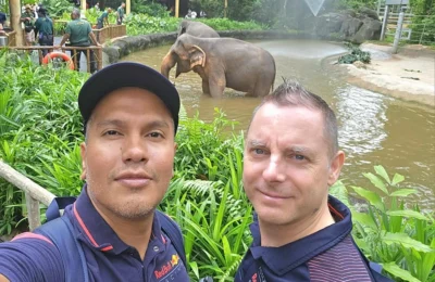 Cruising with Danny and Peter, Holland America Line, Westerdam, Singapore, Singapore Zoo Experience 5 Highlights | Exploring the Singapore Zoo Experience: A lush Rainforest Adventure Singapore in the Fragile Forest with butterflies and sloths, kids enjoying Rainforest Kidzworld—a Family-Friendly Zoo Singapore highlight of the Singapore Zoo Conservation Adventure—with water slides and monkeys promoting Nature Education Singapore, lions and baboons in the Great Rift Valley of Ethiopia Singapore Zoo Exhibit showcasing Singapore Wildlife Adventure and Ecotourism in Singapore, signage highlighting Conservation Efforts Zoo emphasizing Sustainable Tourism Singapore, all at the entrance to this Wildlife Sanctuary Singapore offering top Singapore Zoo Attractions.