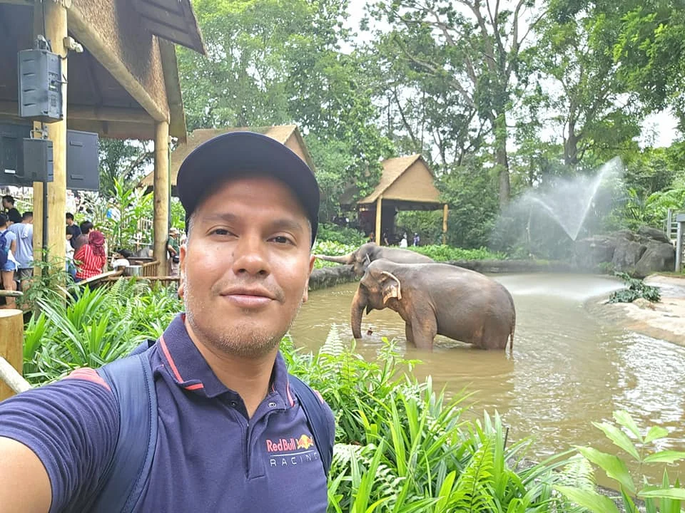 Cruising with Danny and Peter, Holland America Line, Westerdam, Singapore, Singapore Zoo Experience 5 Highlights | Exploring the Singapore Zoo Experience: A lush Rainforest Adventure Singapore in the Fragile Forest with butterflies and sloths, kids enjoying Rainforest Kidzworld—a Family-Friendly Zoo Singapore highlight of the Singapore Zoo Conservation Adventure—with water slides and monkeys promoting Nature Education Singapore, lions and baboons in the Great Rift Valley of Ethiopia Singapore Zoo Exhibit showcasing Singapore Wildlife Adventure and Ecotourism in Singapore, signage highlighting Conservation Efforts Zoo emphasizing Sustainable Tourism Singapore, all at the entrance to this Wildlife Sanctuary Singapore offering top Singapore Zoo Attractions.