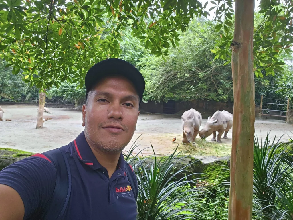 Cruising with Danny and Peter, Holland America Line, Westerdam, Singapore, Singapore Zoo Experience 5 Highlights | Exploring the Singapore Zoo Experience: A lush Rainforest Adventure Singapore in the Fragile Forest with butterflies and sloths, kids enjoying Rainforest Kidzworld—a Family-Friendly Zoo Singapore highlight of the Singapore Zoo Conservation Adventure—with water slides and monkeys promoting Nature Education Singapore, lions and baboons in the Great Rift Valley of Ethiopia Singapore Zoo Exhibit showcasing Singapore Wildlife Adventure and Ecotourism in Singapore, signage highlighting Conservation Efforts Zoo emphasizing Sustainable Tourism Singapore, all at the entrance to this Wildlife Sanctuary Singapore offering top Singapore Zoo Attractions.