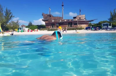 Cruising with Danny and Peter, Holland America Line, Nieuw Amsterdam, Half Moon Cay, Bahamas | A serene day at Half Moon Cay Bahamas showcasing a tranquil beach escape with crystal-clear waters, soft ivory sands, tropical island views, lush greenery, and vibrant coral reefs ideal for snorkeling, capturing the essence of a private island Bahamas retreat in a pristine Caribbean paradise.