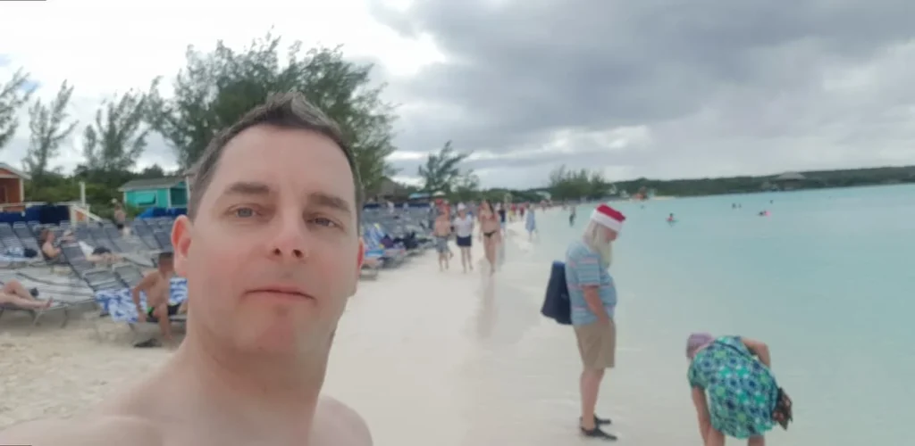 Tranquil Bliss: A Day at Half Moon Cay 3 Cruising with Danny and Peter, Holland America Line, Nieuw Amsterdam, Half Moon Cay, Bahamas | A serene day at Half Moon Cay Bahamas showcasing a tranquil beach escape with crystal-clear waters, soft ivory sands, tropical island views, lush greenery, and vibrant coral reefs ideal for snorkeling, capturing the essence of a private island Bahamas retreat in a pristine Caribbean paradise.