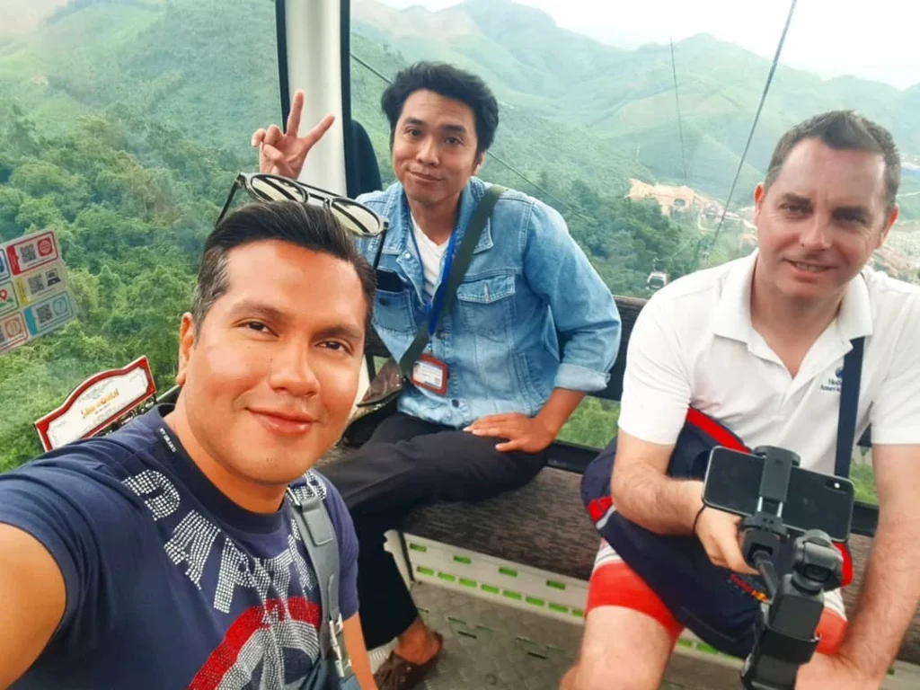 Cruising with Danny and Peter, Holland America Line, Westerdam, Da Nang, Hue, Vietnam | Stunning views of Bana Hills Marble Mountains in Vietnam, featuring the iconic Golden Bridge held by giant stone hands, the charming French Village, and serene Vietnamese Buddhist sanctuaries nestled within the lush limestone hills.