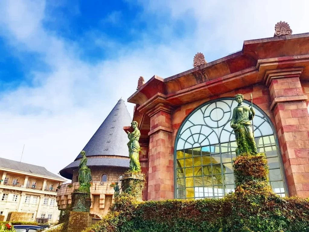 Cruising with Danny and Peter, Holland America Line, Westerdam, Da Nang, Hue, Vietnam | Stunning views of Bana Hills Marble Mountains in Vietnam, featuring the iconic Golden Bridge held by giant stone hands, the charming French Village, and serene Vietnamese Buddhist sanctuaries nestled within the lush limestone hills.