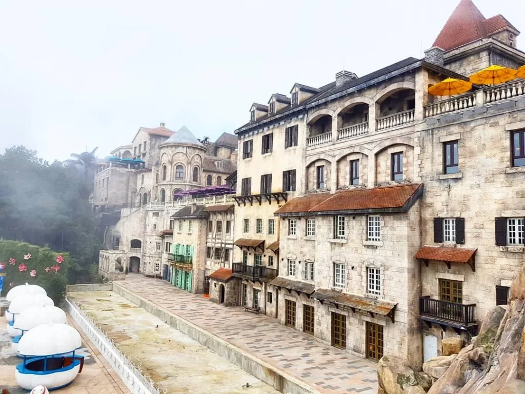 Cruising with Danny and Peter, Holland America Line, Westerdam, Da Nang, Hue, Vietnam | Stunning views of Bana Hills Marble Mountains in Vietnam, featuring the iconic Golden Bridge held by giant stone hands, the charming French Village, and serene Vietnamese Buddhist sanctuaries nestled within the lush limestone hills.