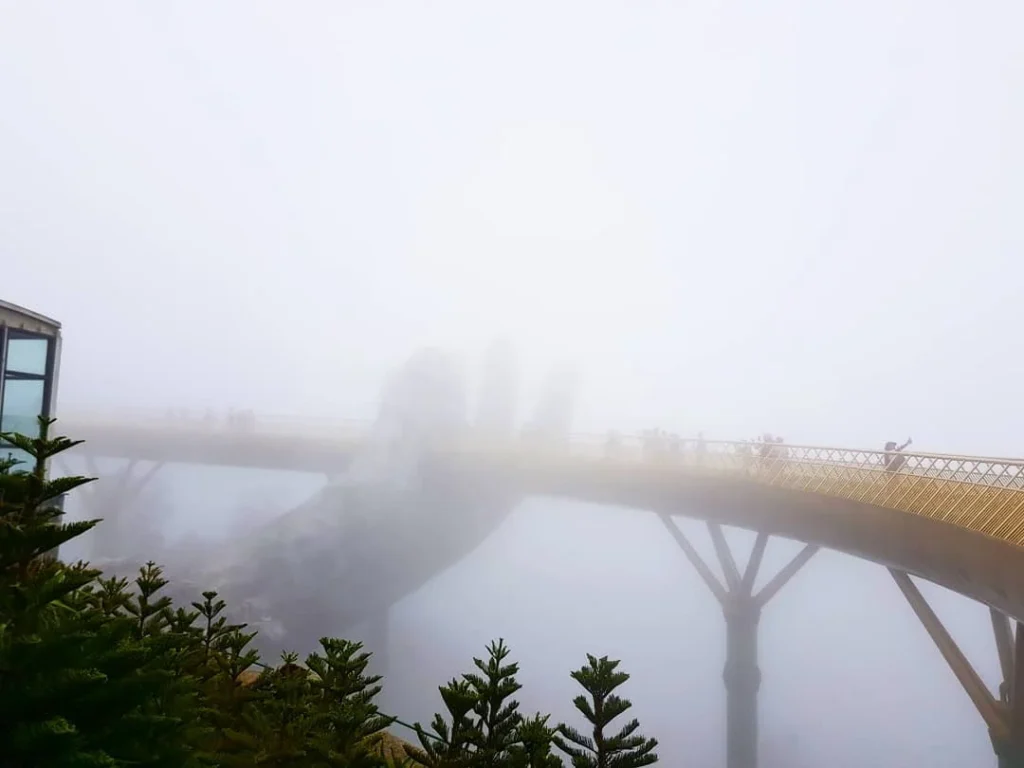 Cruising with Danny and Peter, Holland America Line, Westerdam, Da Nang, Hue, Vietnam | Stunning views of Bana Hills Marble Mountains in Vietnam, featuring the iconic Golden Bridge held by giant stone hands, the charming French Village, and serene Vietnamese Buddhist sanctuaries nestled within the lush limestone hills.