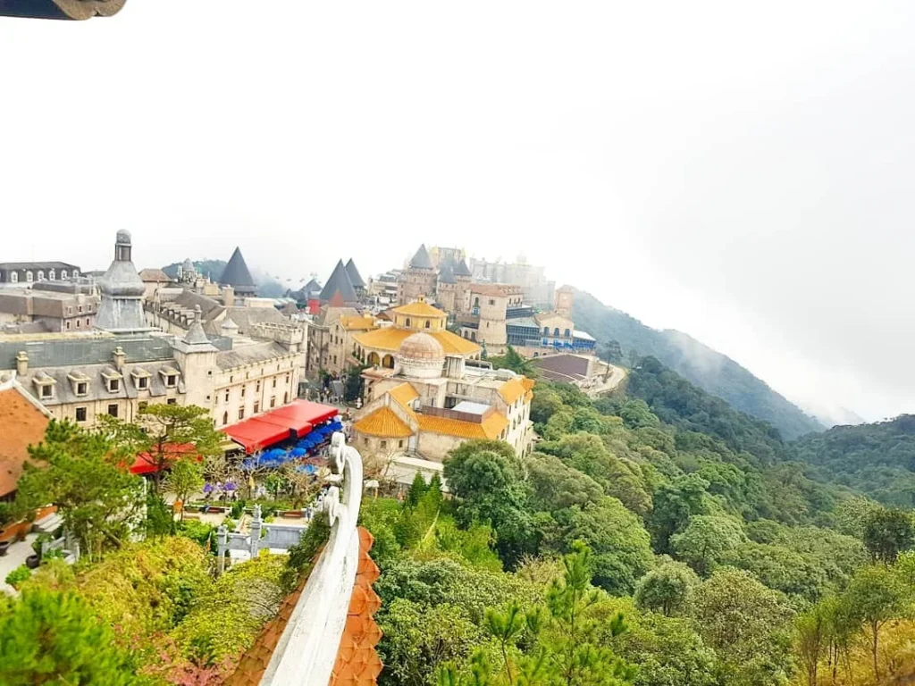 Cruising with Danny and Peter, Holland America Line, Westerdam, Da Nang, Hue, Vietnam | Stunning views of Bana Hills Marble Mountains in Vietnam, featuring the iconic Golden Bridge held by giant stone hands, the charming French Village, and serene Vietnamese Buddhist sanctuaries nestled within the lush limestone hills.