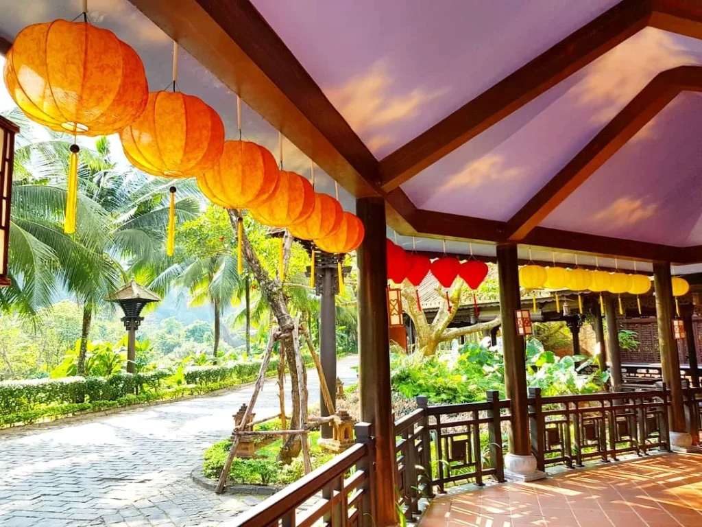 Cruising with Danny and Peter, Holland America Line, Westerdam, Da Nang, Hue, Vietnam | Stunning views of Bana Hills Marble Mountains in Vietnam, featuring the iconic Golden Bridge held by giant stone hands, the charming French Village, and serene Vietnamese Buddhist sanctuaries nestled within the lush limestone hills.