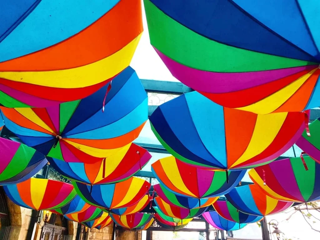 Cruising with Danny and Peter, Holland America Line, Westerdam, Da Nang, Hue, Vietnam | Stunning views of Bana Hills Marble Mountains in Vietnam, featuring the iconic Golden Bridge held by giant stone hands, the charming French Village, and serene Vietnamese Buddhist sanctuaries nestled within the lush limestone hills.