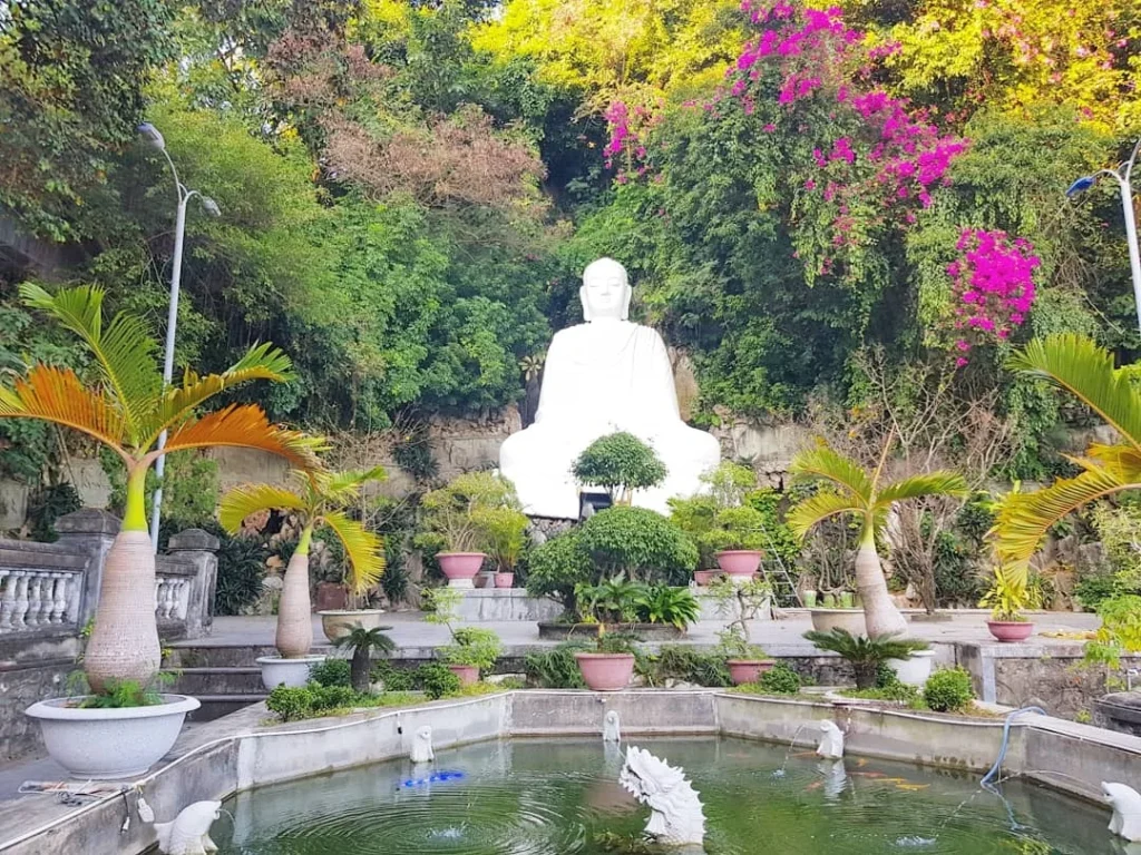 Cruising with Danny and Peter, Holland America Line, Westerdam, Da Nang, Hue, Vietnam | Stunning views of Bana Hills Marble Mountains in Vietnam, featuring the iconic Golden Bridge held by giant stone hands, the charming French Village, and serene Vietnamese Buddhist sanctuaries nestled within the lush limestone hills.