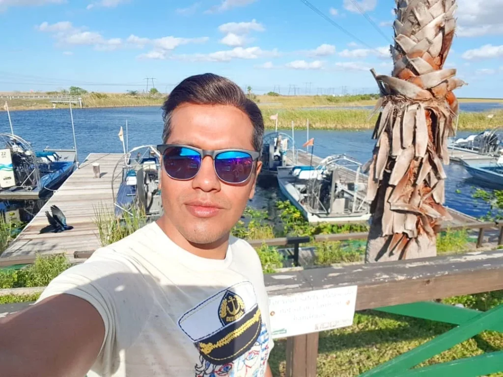 Cruising with Danny and Peter, Holland America Line, Zuiderdam, Fort Lauderdale, Florida, United States | A vibrant scene from the Everglades Adventure showcasing the diverse wildlife during the Daylight Exploration of Everglades, featuring alligators basking in the sun, colorful wading birds foraging in the wetlands, and lush sawgrass prairies under the bright Florida sun, highlighting the unique Everglades Ecosystem and the beauty of outdoor activities in Florida.