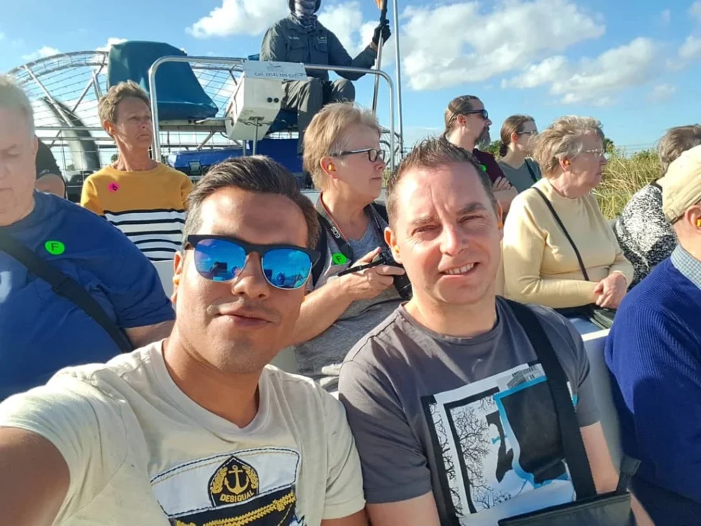 Cruising with Danny and Peter, Holland America Line, Zuiderdam, Fort Lauderdale, Florida, United States | A vibrant scene from the Everglades Adventure showcasing the diverse wildlife during the Daylight Exploration of Everglades, featuring alligators basking in the sun, colorful wading birds foraging in the wetlands, and lush sawgrass prairies under the bright Florida sun, highlighting the unique Everglades Ecosystem and the beauty of outdoor activities in Florida.