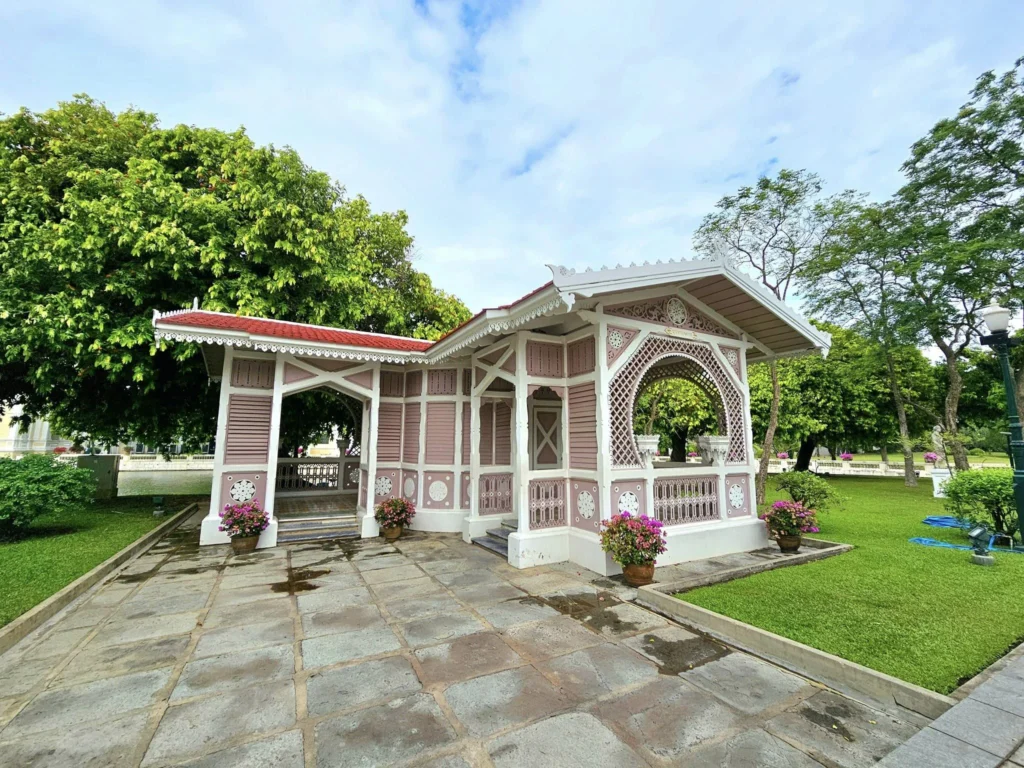 A Majestic Journey: Unveiling the Royal Historical Tour Ayutthaya from the Holland America Cruise 22 Cruising with Danny and Peter, Holland America Line, Westerdam, Laem Chabang, Bangkok, Thailand, Royal Historical Tour Ayutthaya 5 Glorious Stops | Exploring the Royal Historical Tour Ayutthaya and Bang Pa In Ayutthaya with lush gardens at Bang Pa In Palace, the elegant Aisawan Dhipaya Pavilion on a tranquil lake, towering stupa and Buddha statues at Ayutthaya Temples, colorful Traditional Thai Cuisine, and the iconic Buddha head in tree roots at Wat Mahathat Ruins—a UNESCO Heritage Site—all part of an unforgettable Thailand Cultural Tour and Ayutthaya Day Trip from the Holland America Cruise, showcasing Thai Royal History.
