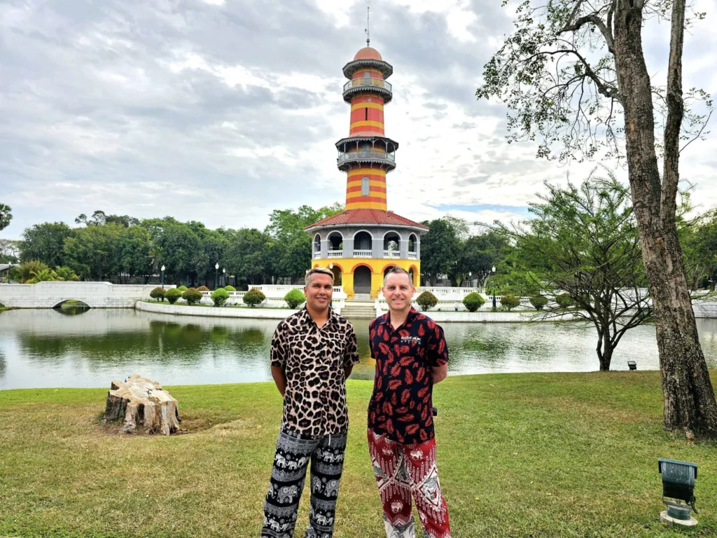 A Majestic Journey: Unveiling the Royal Historical Tour Ayutthaya from the Holland America Cruise 24 Cruising with Danny and Peter, Holland America Line, Westerdam, Laem Chabang, Bangkok, Thailand, Royal Historical Tour Ayutthaya 5 Glorious Stops | Exploring the Royal Historical Tour Ayutthaya and Bang Pa In Ayutthaya with lush gardens at Bang Pa In Palace, the elegant Aisawan Dhipaya Pavilion on a tranquil lake, towering stupa and Buddha statues at Ayutthaya Temples, colorful Traditional Thai Cuisine, and the iconic Buddha head in tree roots at Wat Mahathat Ruins—a UNESCO Heritage Site—all part of an unforgettable Thailand Cultural Tour and Ayutthaya Day Trip from the Holland America Cruise, showcasing Thai Royal History.