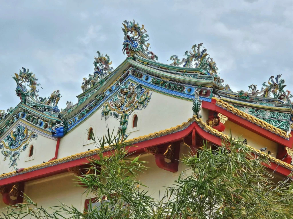 A Majestic Journey: Unveiling the Royal Historical Tour Ayutthaya from the Holland America Cruise 26 Cruising with Danny and Peter, Holland America Line, Westerdam, Laem Chabang, Bangkok, Thailand, Royal Historical Tour Ayutthaya 5 Glorious Stops | Exploring the Royal Historical Tour Ayutthaya and Bang Pa In Ayutthaya with lush gardens at Bang Pa In Palace, the elegant Aisawan Dhipaya Pavilion on a tranquil lake, towering stupa and Buddha statues at Ayutthaya Temples, colorful Traditional Thai Cuisine, and the iconic Buddha head in tree roots at Wat Mahathat Ruins—a UNESCO Heritage Site—all part of an unforgettable Thailand Cultural Tour and Ayutthaya Day Trip from the Holland America Cruise, showcasing Thai Royal History.