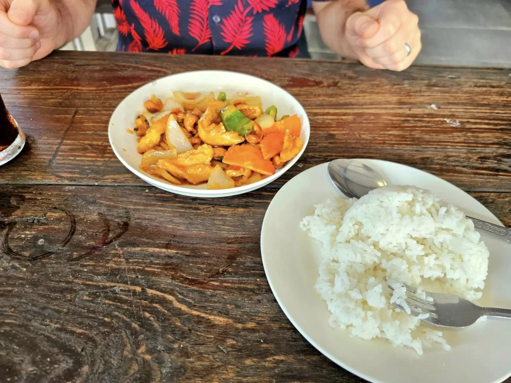 A Majestic Journey: Unveiling the Royal Historical Tour Ayutthaya from the Holland America Cruise 7 Cruising with Danny and Peter, Holland America Line, Westerdam, Laem Chabang, Bangkok, Thailand, Royal Historical Tour Ayutthaya 5 Glorious Stops | Exploring the Royal Historical Tour Ayutthaya and Bang Pa In Ayutthaya with lush gardens at Bang Pa In Palace, the elegant Aisawan Dhipaya Pavilion on a tranquil lake, towering stupa and Buddha statues at Ayutthaya Temples, colorful Traditional Thai Cuisine, and the iconic Buddha head in tree roots at Wat Mahathat Ruins—a UNESCO Heritage Site—all part of an unforgettable Thailand Cultural Tour and Ayutthaya Day Trip from the Holland America Cruise, showcasing Thai Royal History.