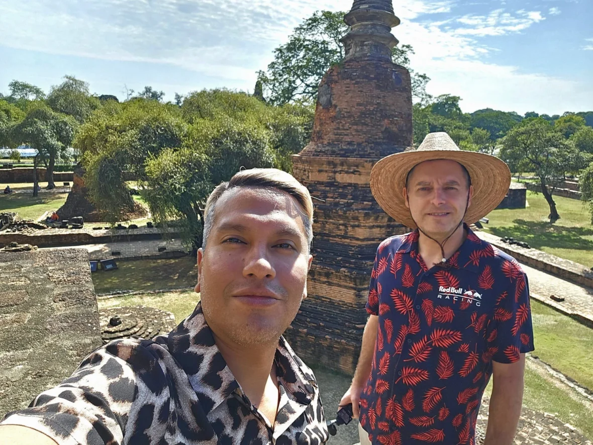 A Majestic Journey: Unveiling the Royal Historical Tour Ayutthaya from the Holland America Cruise 1 Cruising with Danny and Peter, Holland America Line, Westerdam, Laem Chabang, Bangkok, Thailand, Royal Historical Tour Ayutthaya 5 Glorious Stops | Exploring the Royal Historical Tour Ayutthaya and Bang Pa In Ayutthaya with lush gardens at Bang Pa In Palace, the elegant Aisawan Dhipaya Pavilion on a tranquil lake, towering stupa and Buddha statues at Ayutthaya Temples, colorful Traditional Thai Cuisine, and the iconic Buddha head in tree roots at Wat Mahathat Ruins—a UNESCO Heritage Site—all part of an unforgettable Thailand Cultural Tour and Ayutthaya Day Trip from the Holland America Cruise, showcasing Thai Royal History.