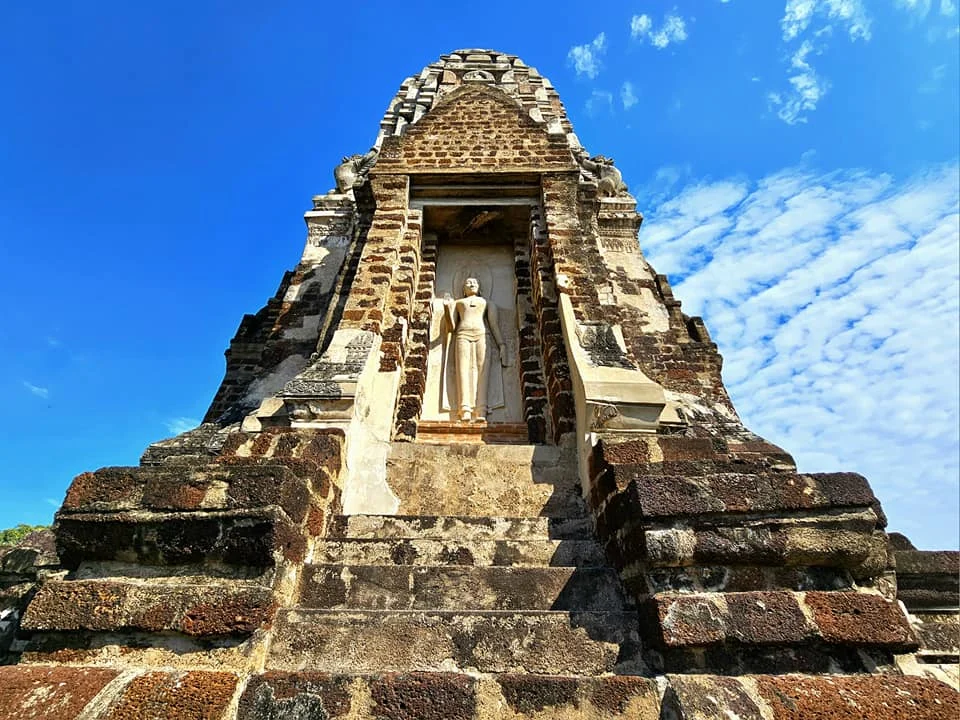 A Majestic Journey: Unveiling the Royal Historical Tour Ayutthaya from the Holland America Cruise 9 Cruising with Danny and Peter, Holland America Line, Westerdam, Laem Chabang, Bangkok, Thailand, Royal Historical Tour Ayutthaya 5 Glorious Stops | Exploring the Royal Historical Tour Ayutthaya and Bang Pa In Ayutthaya with lush gardens at Bang Pa In Palace, the elegant Aisawan Dhipaya Pavilion on a tranquil lake, towering stupa and Buddha statues at Ayutthaya Temples, colorful Traditional Thai Cuisine, and the iconic Buddha head in tree roots at Wat Mahathat Ruins—a UNESCO Heritage Site—all part of an unforgettable Thailand Cultural Tour and Ayutthaya Day Trip from the Holland America Cruise, showcasing Thai Royal History.