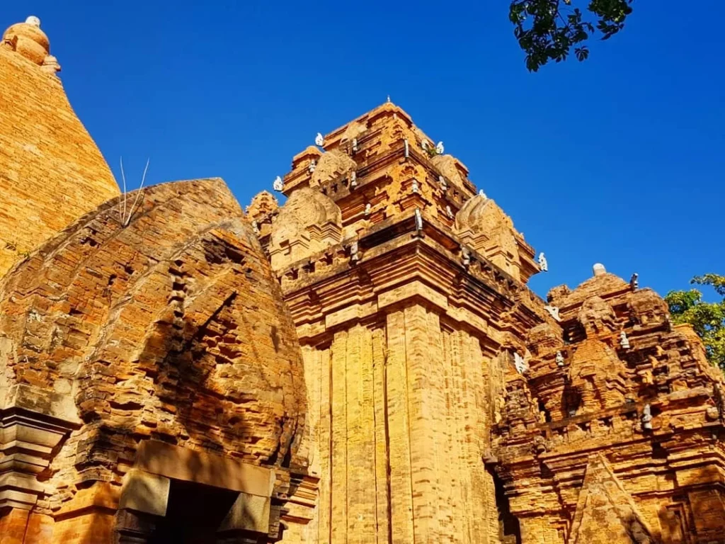 Cruising with Danny and Peter, Holland America Line, Westerdam, Nha Trang, Vietnam | Vibrant local markets in Nha Trang showcasing fresh produce and street food during a Nha Trang tour experience; scenic river cruise views with lush landscapes; delicious Vietnamese dishes like pho and banh mi from a Nha Trang food tour; historical sites featuring ancient temples and architecture in Nha Trang, Vietnam.