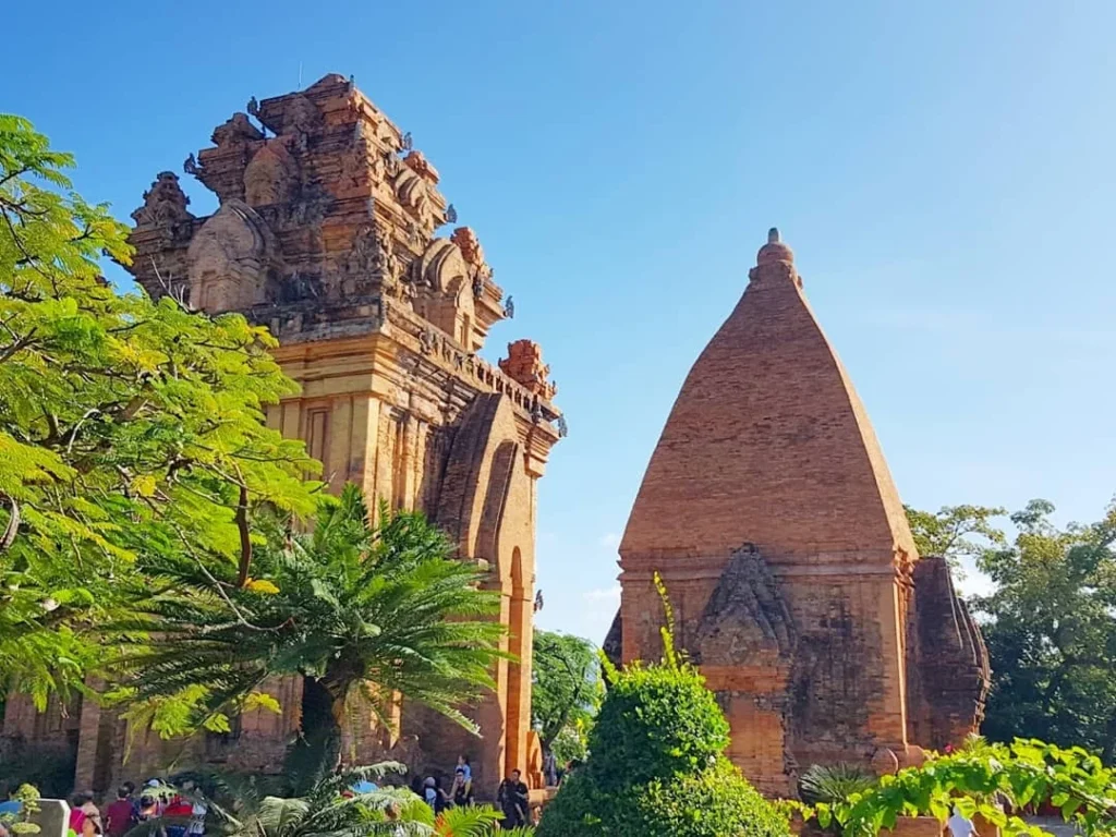 Cruising with Danny and Peter, Holland America Line, Westerdam, Nha Trang, Vietnam | Vibrant local markets in Nha Trang showcasing fresh produce and street food during a Nha Trang tour experience; scenic river cruise views with lush landscapes; delicious Vietnamese dishes like pho and banh mi from a Nha Trang food tour; historical sites featuring ancient temples and architecture in Nha Trang, Vietnam.